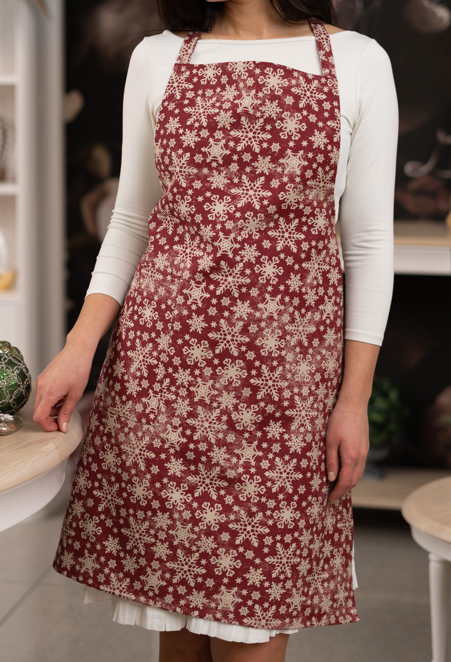 Red Christmas Ladies Apron, with snowflake print.
