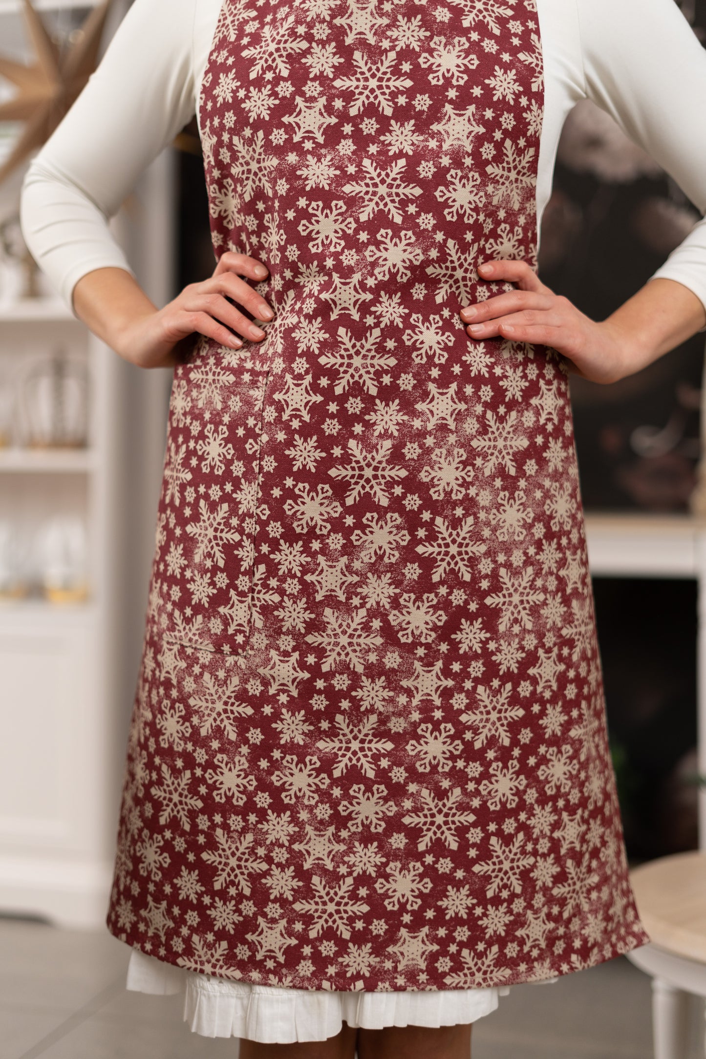 Red Christmas Ladies Apron, with snowflake print.